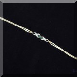 J08. Gold and gemstone bracelet. 